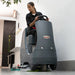 NaceCare CRL 2128 compact ride-on scrubber cleaning a commercial floor