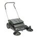 NaceCare NC 3 manual push sweeper at an angle, showing the push handle, hopper and side brooms
