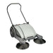 NaceCare NC 4 manual sweeper at an angle, showing the push handle, grey housing and two side brooms