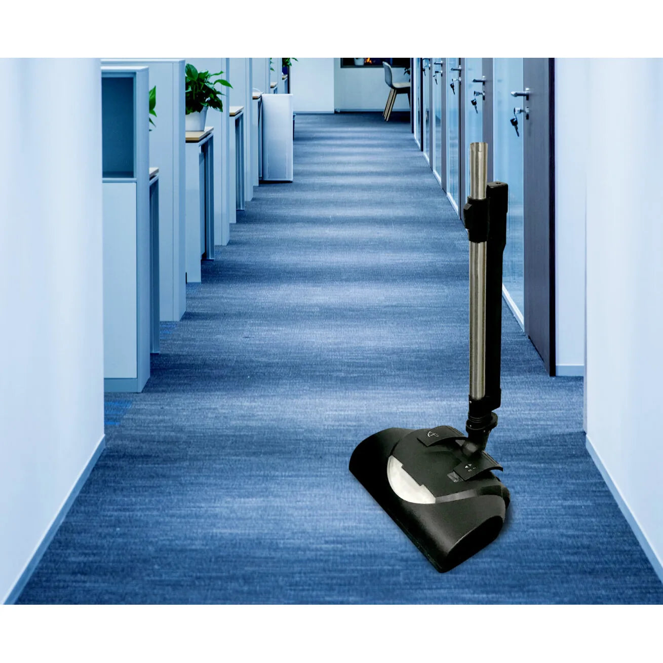 NaceCare battery power brush vacuuming a carpeted office hallway