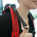 Close-up of the harness height adjustment tabs on the NaceCare RSV 150 backpack vacuum