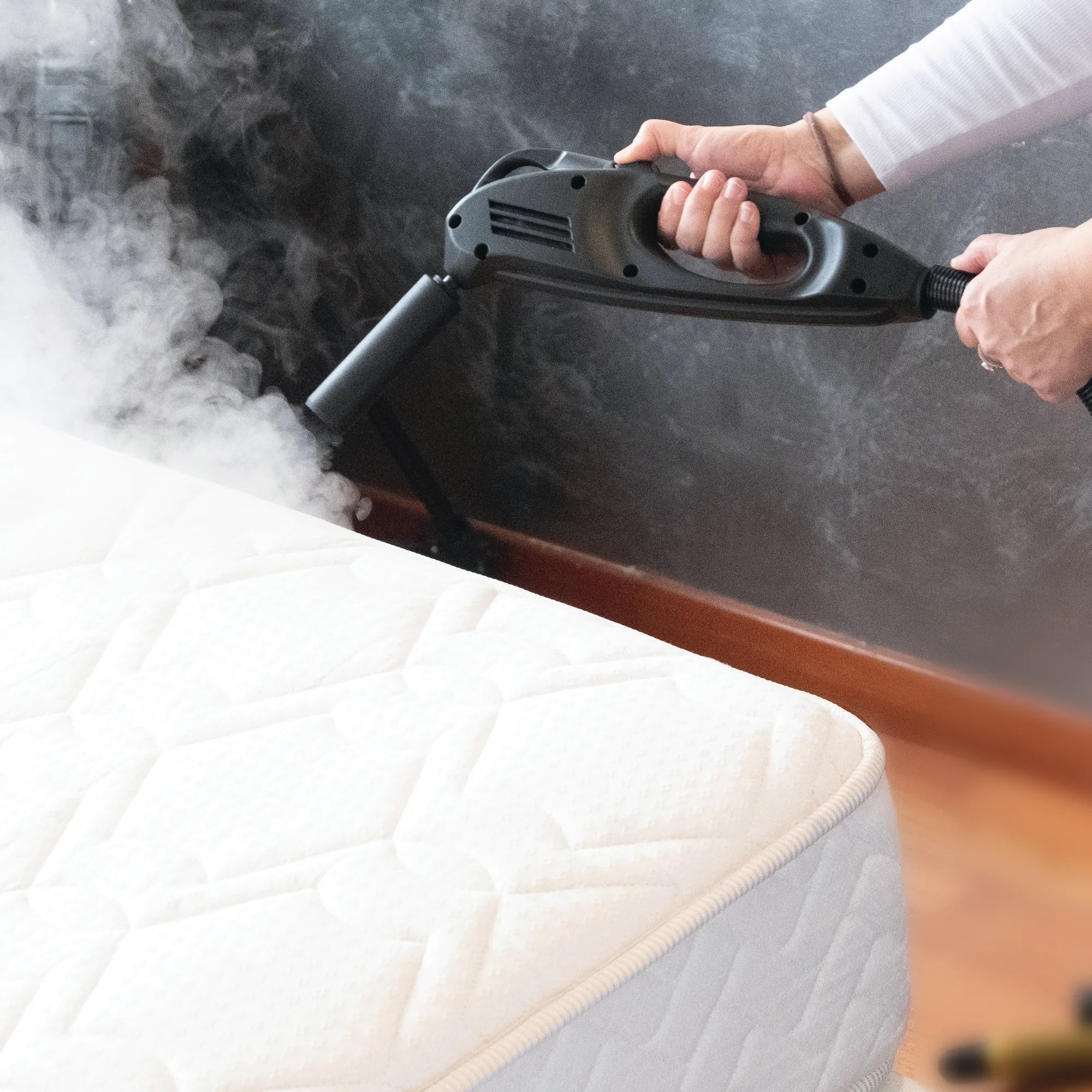 Steam-X bed bug steam gun treating the surface and seams of a mattress