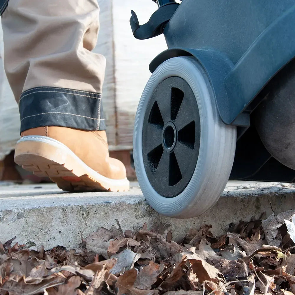 Large all-terrain rear wheel of the TEL 390 rolling over rough ground