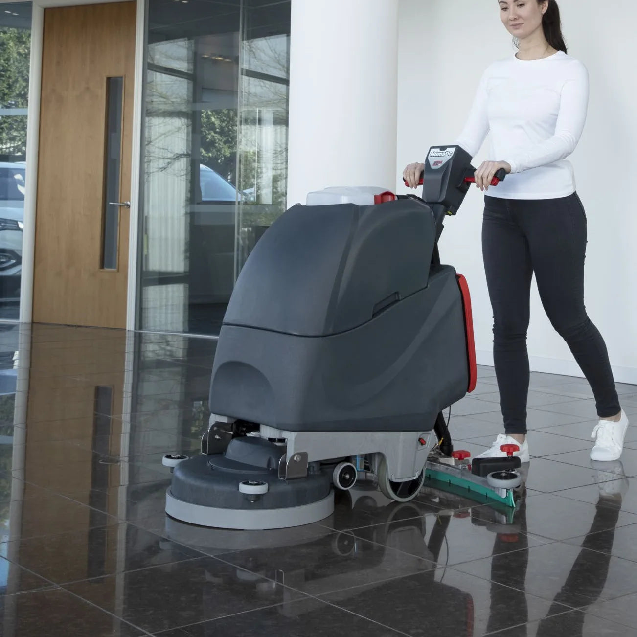 NaceCare TGB 817NX scrubbing a polished office lobby floor