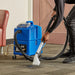 Operator cleaning carpet with the NaceCare TP 4X spotter