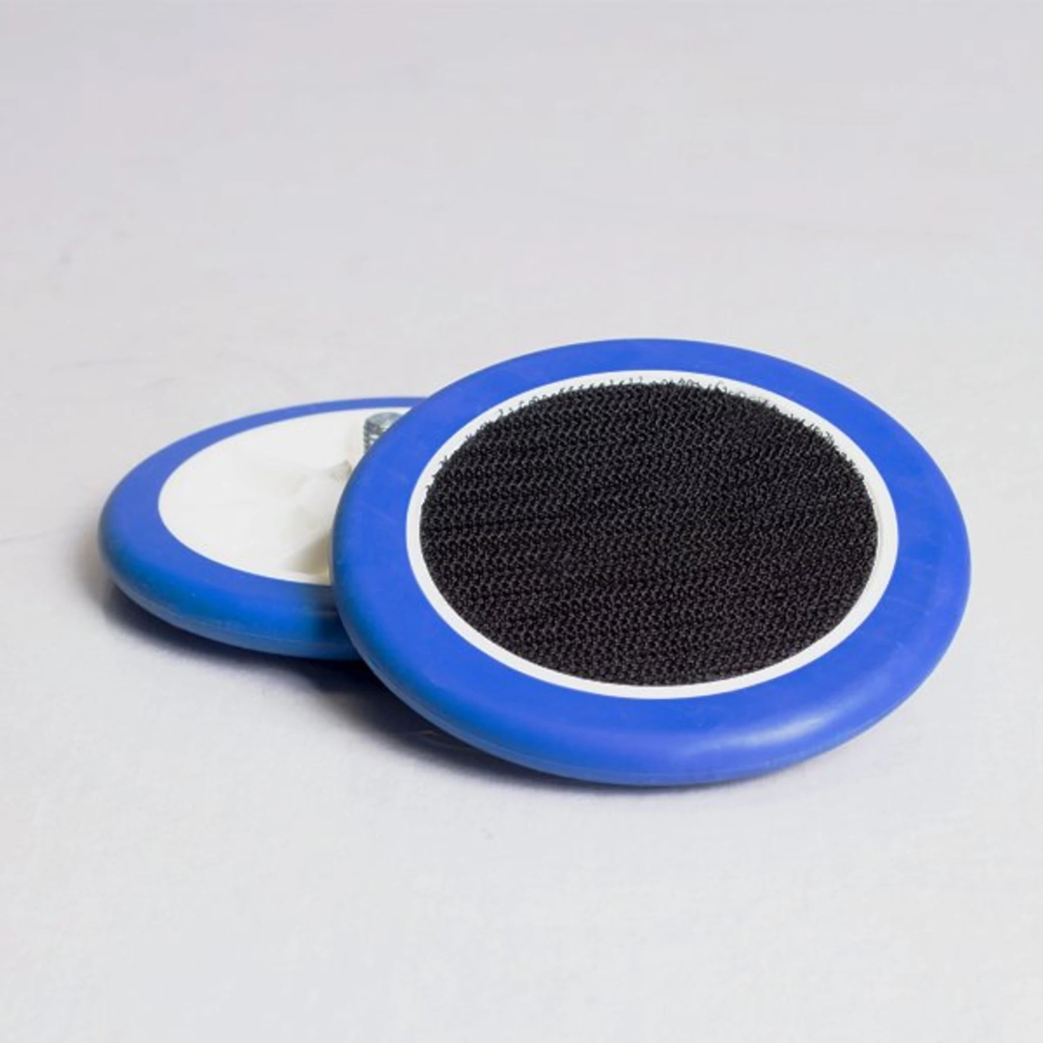 Pair of blue Orbot Micro Velcro pad driver plates with black hook faces