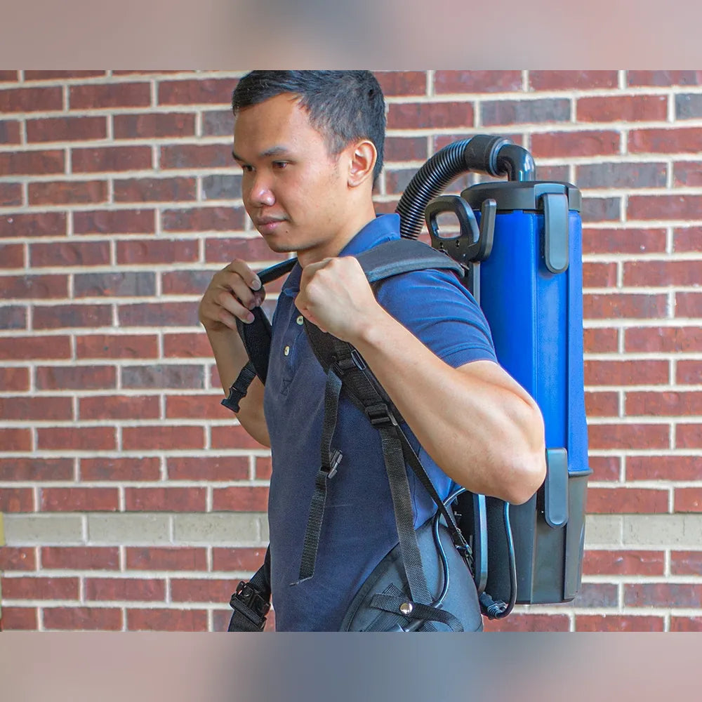 Operator adjusting the shoulder straps of a Pro-Lite BP4S backpack vacuum