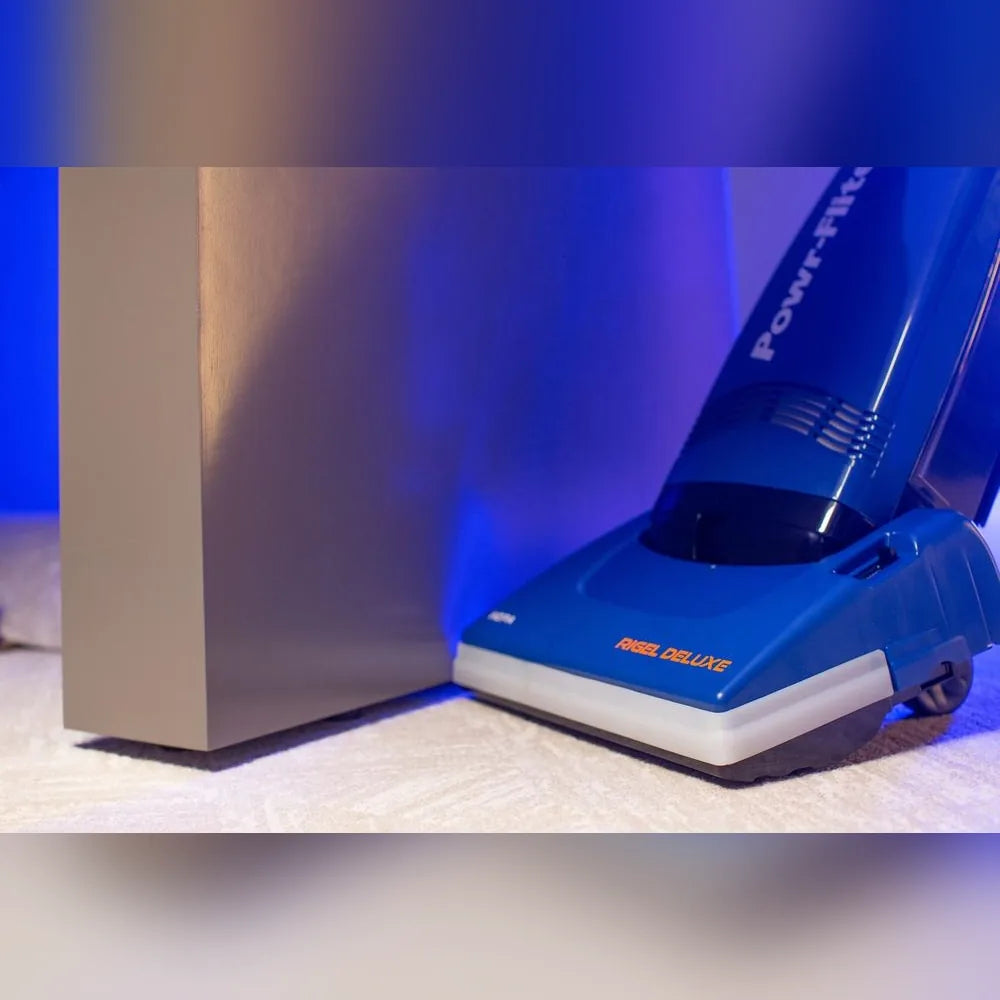 Rigel Deluxe nozzle cleaning commercial carpet beside a column
