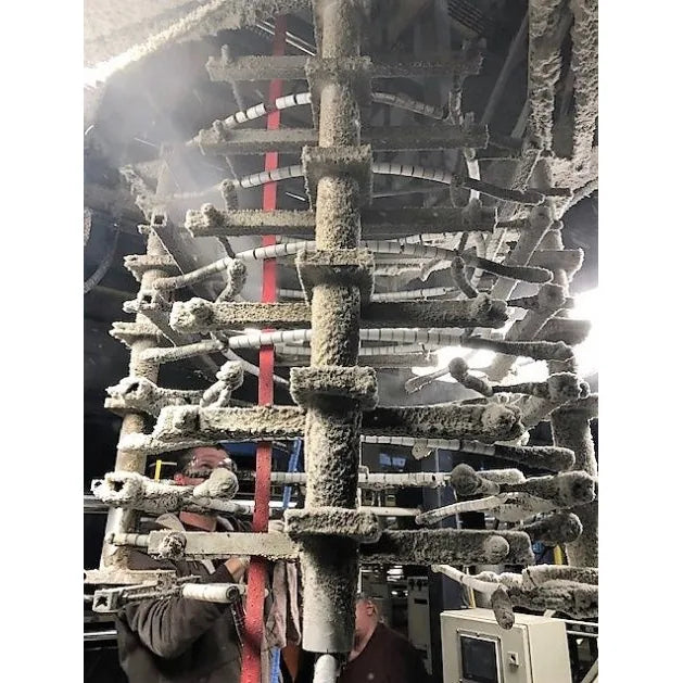 Therma-Steem dry vapor steam cleaning greasy conveyor carrier racks in a production plant