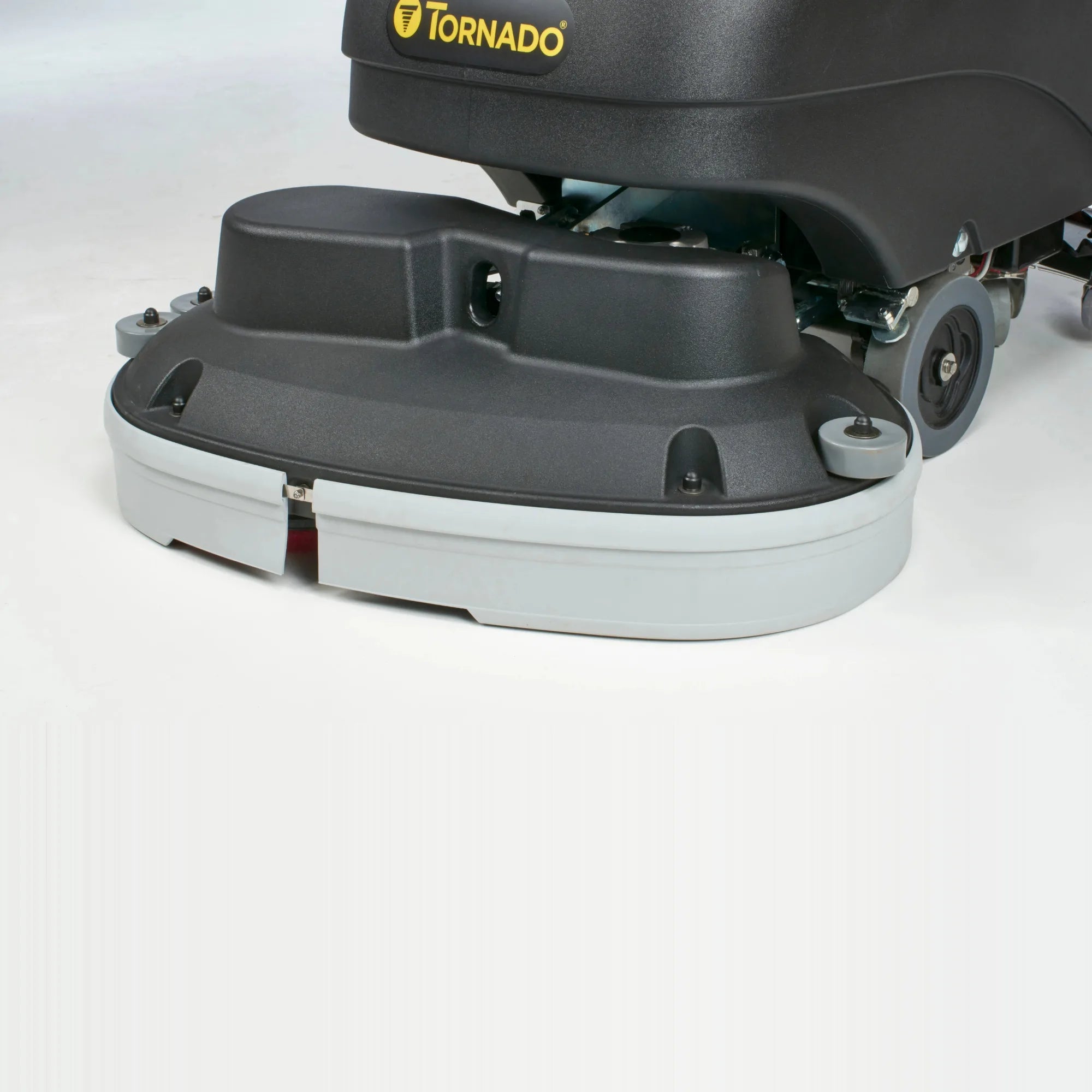 Close-up of the Tornado BD 30/20 dual disk scrub deck and bumper wheels