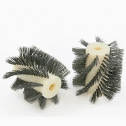 Left and right Tornado Tynex brushes side by side, showing the spiral bristle rows on the white cores