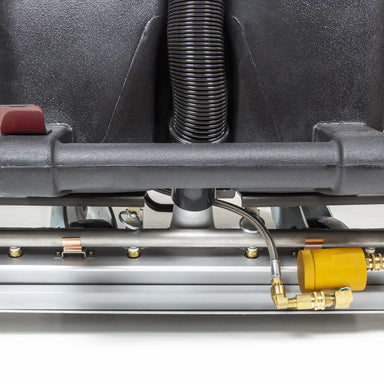 Close-up of the Tornado Cascade 20 cleaning head and its solution and vacuum hose connections