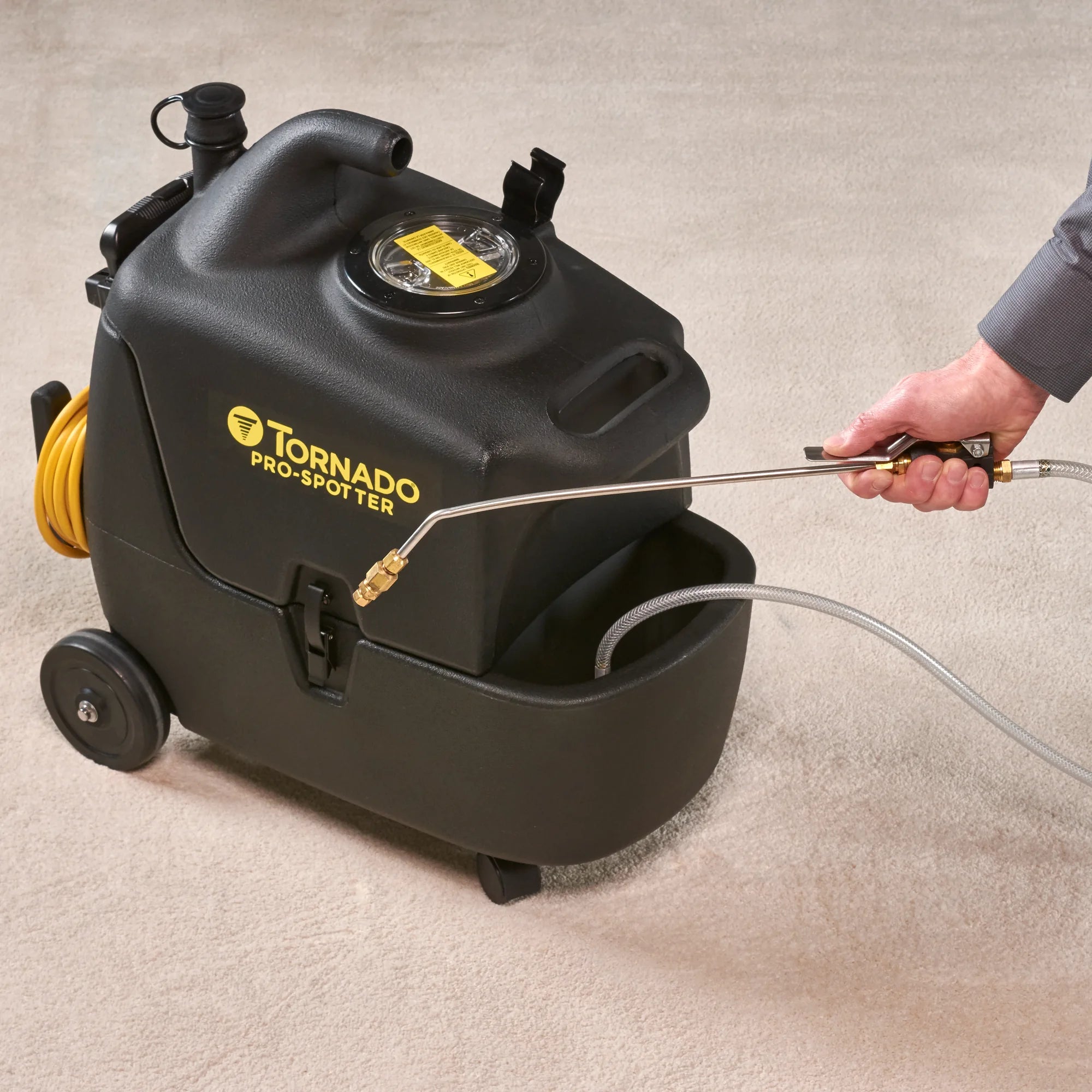 Pre-spraying a carpet spot with the Tornado Pro Spotter Deluxe pre-spray wand