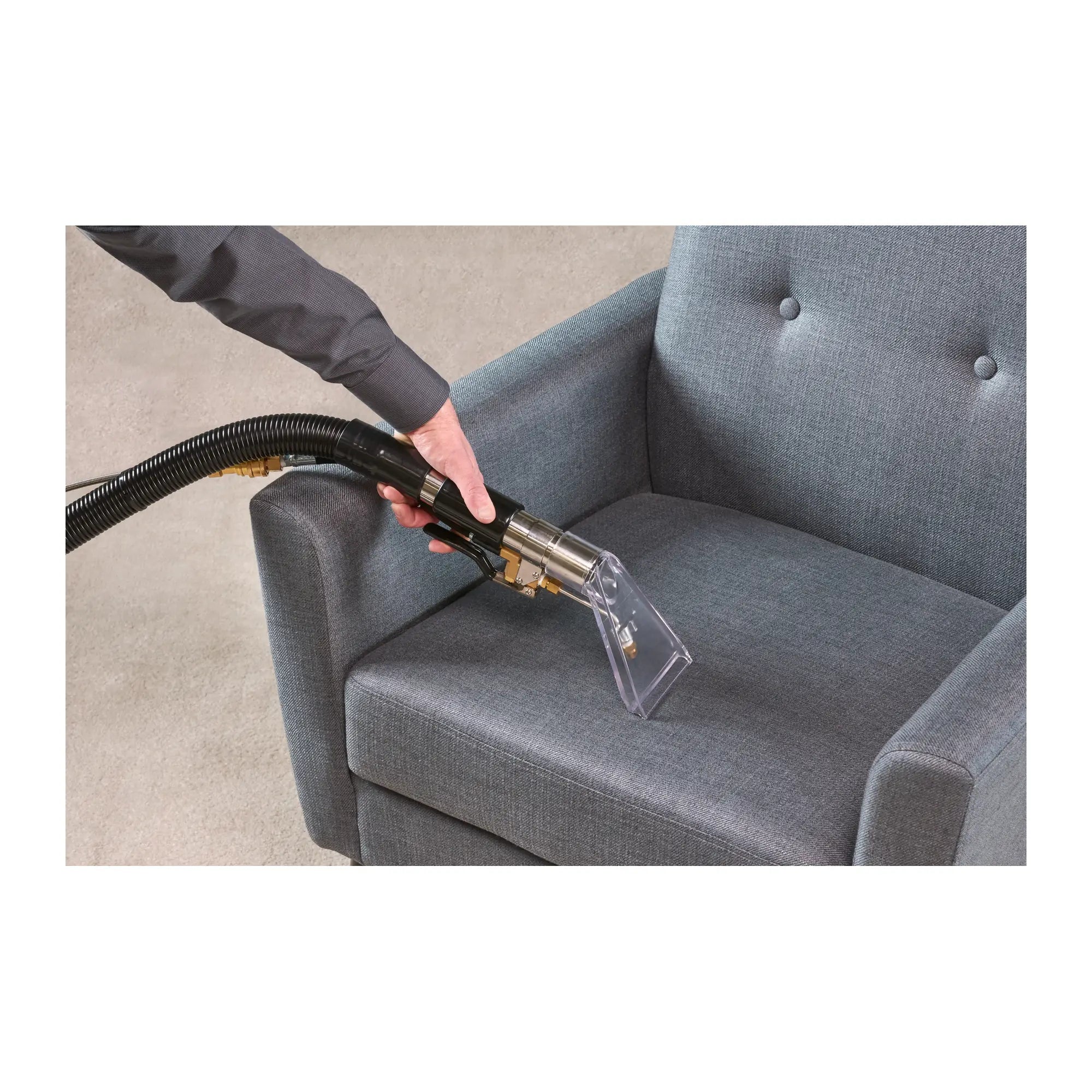 Cleaning an upholstered chair with the Tornado Pro Spotter portable carpet spotter hand tool