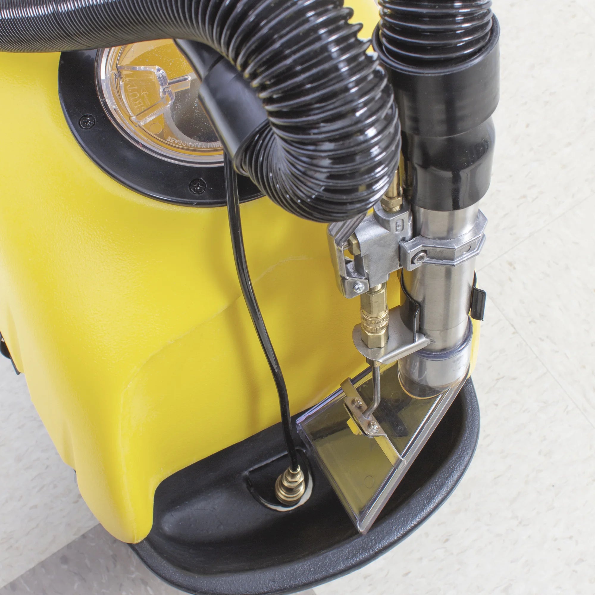 Close-up of the hose connections on the Tornado PS Spotter portable carpet spotter